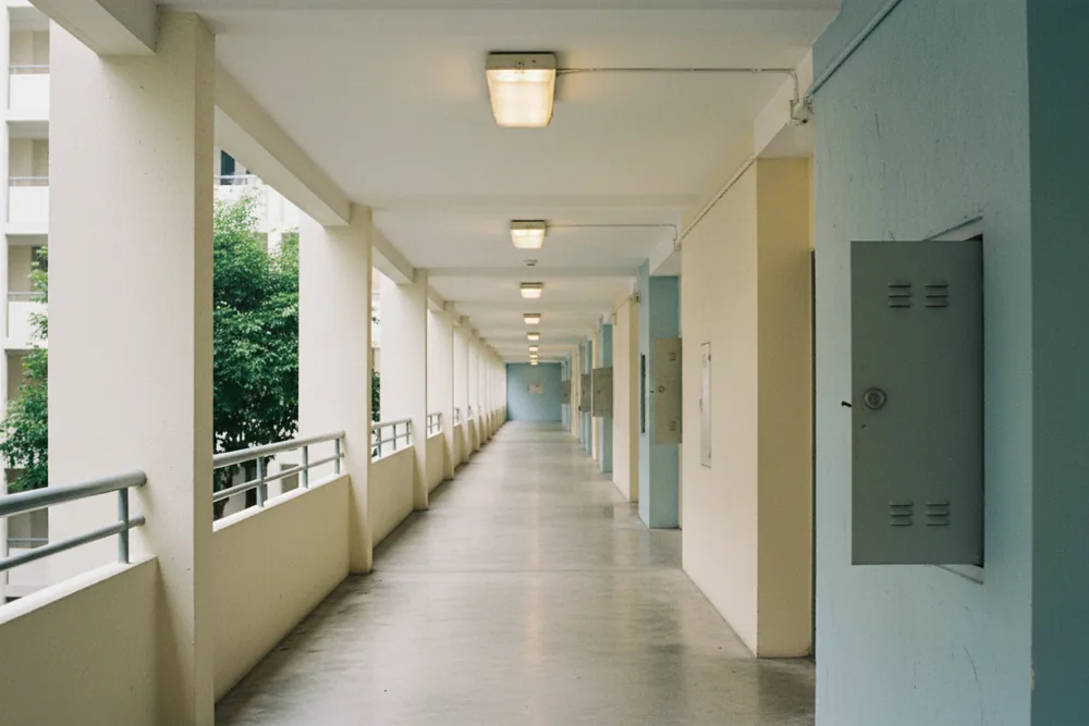 HDB corridor with common-area lighting